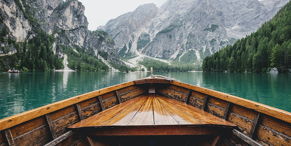 Boat on the lake with mountain view.