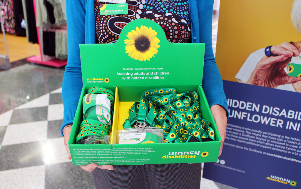 Hidden Disabilities Sunflower Products: Lanyards and wristbands, green with yellow sunflowers.