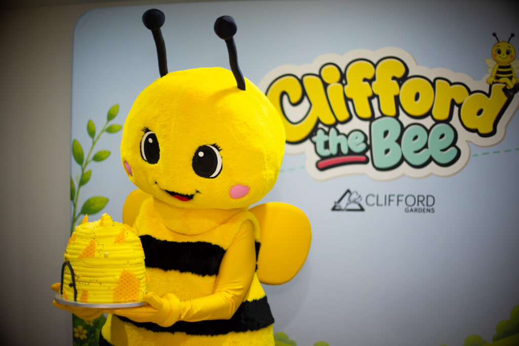 Clifford The Bee Sweetens His Homecoming Celebrating His Return With A Festive Cake, Clifford Gardens