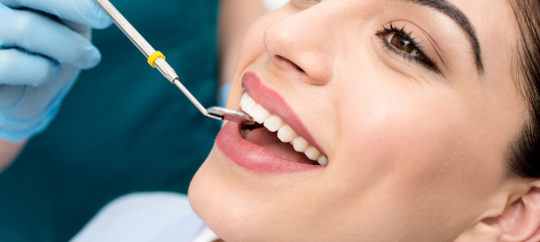 lady sitting in dentist chair smiling