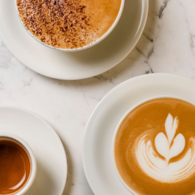 3 mugs of coffee on a white benchtop