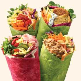 4 different coloured wraps (food) with different fillings including veggies, meat and falafel.