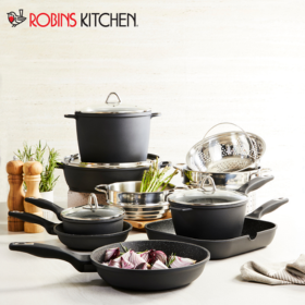 Pots, pans and kitchen supplies on a table with Robins Kitchen logo in the left hand corner